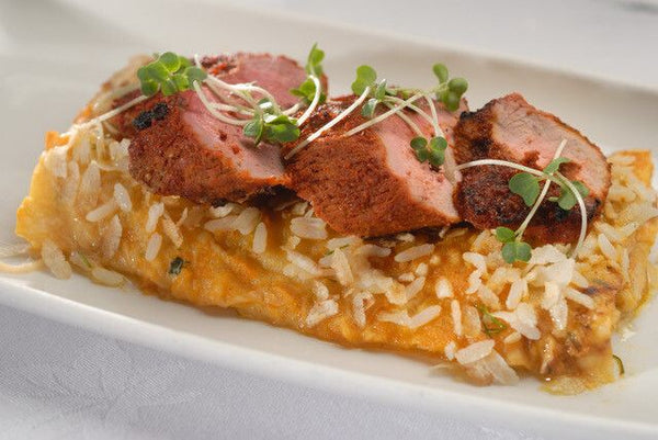 pan seared female duck breast. served with lemon rice.