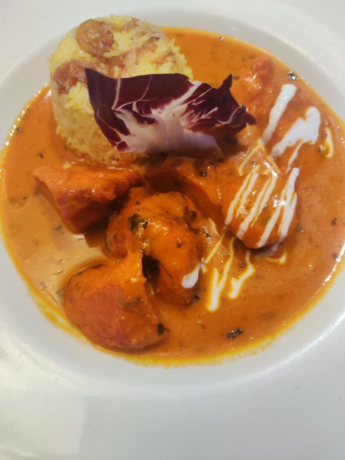 south indian tandoori butter chicken. served with saffron rice.