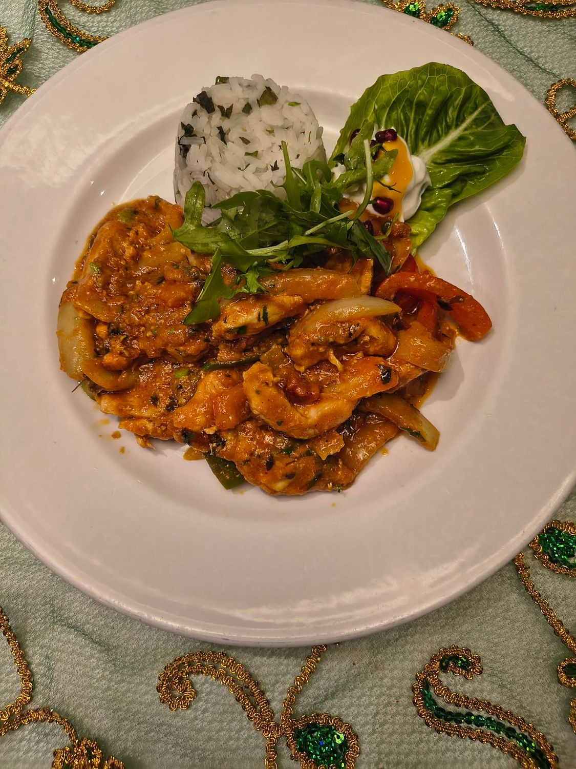 Piyaza Chicken-strips of corn fed chicken breast in jalfrezi style sauce. served with herbed rice.